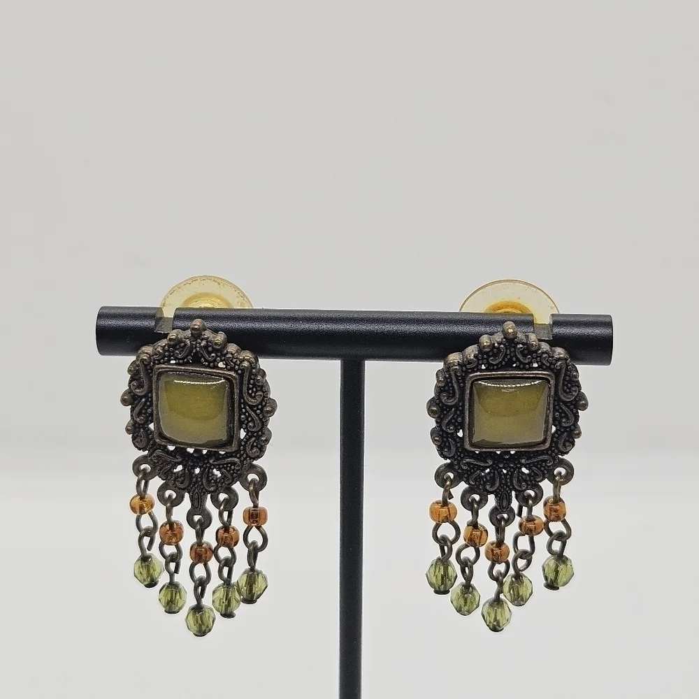 bronze colored earrings with green and orange beading